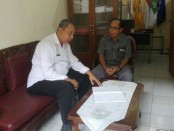 Kepala SMP Sapta Andika Wayan Sutarjana menerima tim pemantau dari Dinas Pendidikan Kota Denpasar - foto: Koranjuri.com