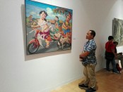 Karya Karikatural Faizin, seorang pelukis asal Banyuwangi di Pameran lukisan berjudul 'Connectedness' di Santrian Gallery Sanur - foto: Koranjuri.com