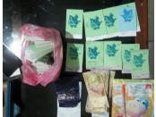 Sejumlah barang bukti hasil perjudian berupa uang dan kupon judi yang diamankan - foto: Sujono/Koranjuri.com