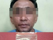 Subnit Narkoba Polsek Tambora Polres Metro Jakarta Barat menangkap SU (30) tukang Ojek Online lantaran kedapatan miliki narkoba jenis sabu - foto: Istimewa